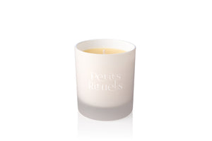 Cinnamon and clove candle in white frosted glass.