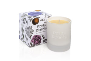 Aromatherapy stress relief candle in luxury white frosted glass and floral packaging.