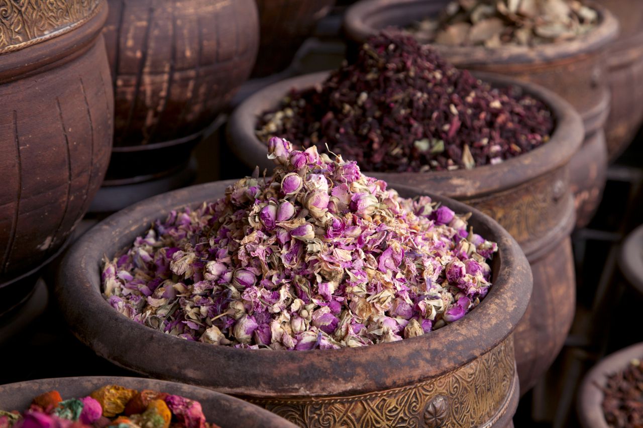 Harvested roses in old wooden pots.