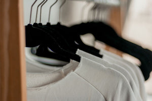 Hanged White Shirts on Black Clothes Hangers.