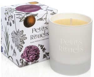 Floral scented candle in white frosted glass and floral packaging.