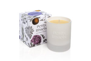 Aromatherapy candles for stress relief in white glass and floral packaging..