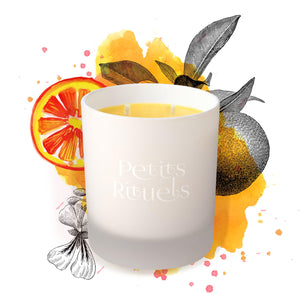 Citrus candle with illustration of oranges.