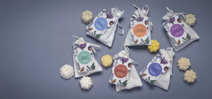 Essential oil wax melts in a small white cotton bag.