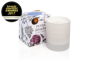 Lavender scented candle in luxury white glass and floral packaging.
