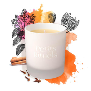 Cinnamon and clove candle in white frosted glass with cinnamon and clove illustration.